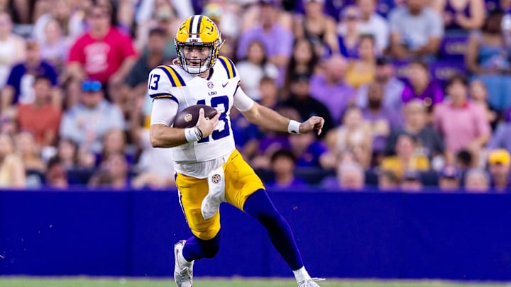 Sep 7, 2024; Baton Rouge, Louisiana, USA; LSU Tigers quarterback Garrett Nussmeier (13) scrambles out the pocket against the Nicholls State Colonels during the first half at Tiger Stadium. Mandatory Credit: Stephen Lew-Imagn Images