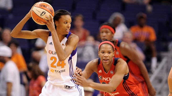 Jun. 20, 2012; Phoenix, AZ, USA; Phoenix Mercury guard DeWanna Bonner (24) handles the ball against the Washington Mystics forward Monique Currie (25) during the second half at US Airways Center. The Mercury defeated the Mystics 79-77. Mandatory Credit: Jennifer Stewart-Imagn Images