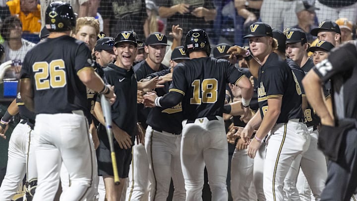 Vanderbilt Commodores players welcome in outfielder JD Rogers (18) and infielder Braden Holcomb (26) after they scored on a single by infielder Davis Diaz against the Mississippi State Bulldogs during the SEC Baseball Tournament at Hoover Metropolitan Stadium. Vanderbilt Commodores players welcome in outfielder JD Rogers (18) and infielder Braden Holcomb (26) after they scored on a single by infielder Davis Diaz against the Mississippi State Bulldogs during the SEC Baseball Tournament at Hoover Metropolitan Stadium.