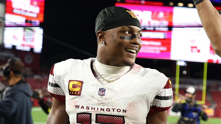 Jan 12, 2025; Tampa, Florida, USA; Washington Commanders wide receiver Terry McLaurin (17) and linebacker Bobby Wagner (54) celebrate after winning a NFC wild card playoff against the Tampa Bay Buccaneers at Raymond James Stadium. Mandatory Credit: Nathan Ray Seebeck-Imagn Images