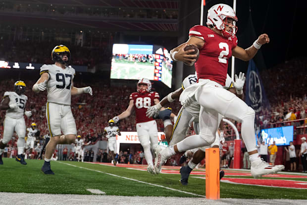 Nebraska Cornhuskers quarterback Adrian Martinez (2) scores a touchdown against the Michigan Wolverines.