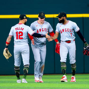 May 19, 2024; Arlington, Texas, USA; Los Angeles Angels outfielder Kevin Pillar (12) and Los Angeles Angels outfielder Mickey Moniak (16) and Los Angeles Angels outfielder Jo Adell (7) celebrate after the game against the Texas Rangers at Globe Life Field. Mandatory Credit: Kevin Jairaj-USA TODAY Sports