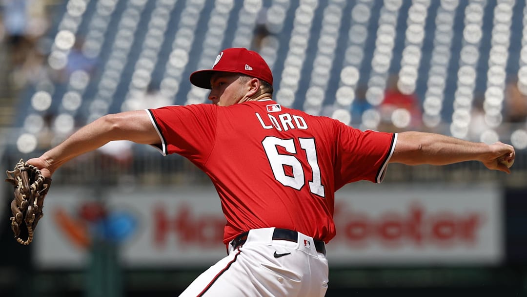 Aug 3, 2025; Washington, District of Columbia, USA; Washington Nationals starting pitcher Brad Lord (61) pitches against the Milwaukee Brewers during the second inning at Nationals Park. 