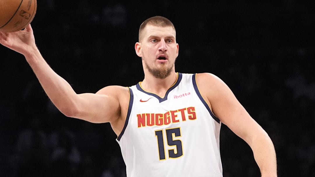 Oct 29, 2024; Brooklyn, New York, USA; Denver Nuggets center Nikola Jokic (15) passes the ball against Brooklyn Nets forward Noah Clowney (21) during the first half at Barclays Center. Mandatory Credit: Gregory Fisher-Imagn Images Oct 29, 2024; Brooklyn, New York, USA; Denver Nuggets center Nikola Jokic (15) passes the ball against Brooklyn Nets forward Noah Clowney (21) during the first half at Barclays Center. Mandatory Credit: Gregory Fisher-Imagn Images