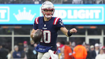  New England Patriots quarterback Drake Maye (10) rolls out to throw the ball against the Los Angeles Chargers during the second half at Gillette Stadium.