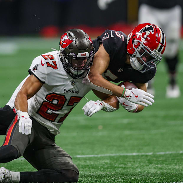Tampa Bay Buccaneers cornerback Zyon McCollum tackles Atlanta Falcons wide receiver Drake London.