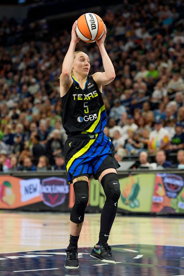 Dallas Wings guard Paige Bueckers catches a pass and looks to shoot against the Minnesota Lynx