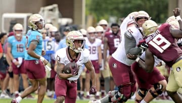 Apr 20, 2024; Tallahassee, Florida, USA; Florida State Seminoles running back Jaylin Lucas (13) runs with the ball during the Spring Showcase at Doak S. Campbell Stadium. Mandatory Credit: Melina Myers-USA TODAY Sports