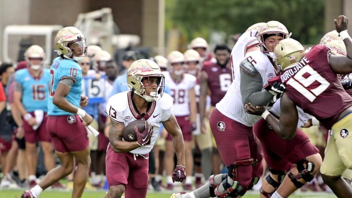 Apr 20, 2024; Tallahassee, Florida, USA; Florida State Seminoles running back Jaylin Lucas (13) runs with the ball during the Spring Showcase at Doak S. Campbell Stadium. Mandatory Credit: Melina Myers-USA TODAY Sports