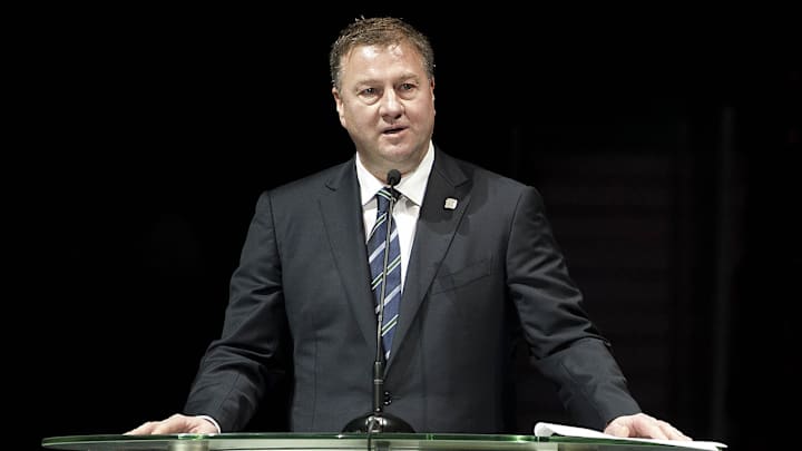Dec 11, 2010; Vancouver, British Columbia, CANADA;  Mike Gillis gives a speech as the Vancouver Canucks host Markus Naslund night to retire his jersey at Rogers Arena. Mandatory Credit: Anne-Marie Sorvin-Imagn Images