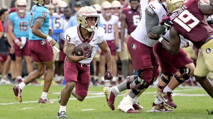 Apr 20, 2024; Tallahassee, Florida, USA; Florida State Seminoles running back Jaylin Lucas (13) runs with the ball during the Spring Showcase at Doak S. Campbell Stadium. Mandatory Credit: Melina Myers-USA TODAY Sports