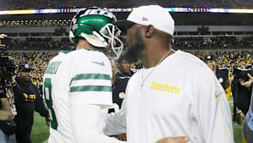 Oct 20, 2024; Pittsburgh, Pennsylvania, USA;  New York Jets quarterback Aaron Rodgers (8) and Pittsburgh Steelers head coach Mike Tomlin (right) greet each other after their game at Acrisure Stadium. Mandatory Credit: Charles LeClaire-Imagn Images
