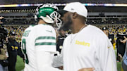 New York Jets quarterback Aaron Rodgers and Pittsburgh Steelers head coach Mike Tomlin greet each other after their game at Acrisure Stadium. 