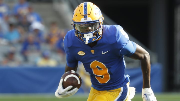 Sep 2, 2023; Pittsburgh, Pennsylvania, USA;  Pittsburgh Panthers wide receiver Konata Mumpfield (9) runs after  a catch against the Wofford Terriers during the third quarter at Acrisure Stadium. Pittsburgh won 45-7. Mandatory Credit: Charles LeClaire-USA TODAY Sports