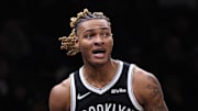 Dec 6, 2025; Brooklyn, New York, USA; Brooklyn Nets forward Noah Clowney (21) reacts after a play during the second half against the New Orleans Pelicans at Barclays Center. Mandatory Credit: Vincent Carchietta-Imagn Images