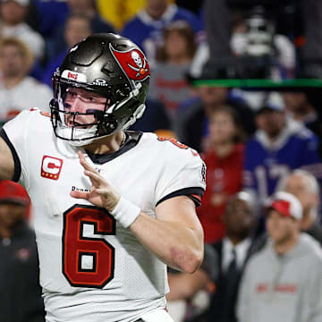 Tampa Bay Buccaneers quarterback Baker Mayfield gets rid of the ball while pressured by Buffalo Bills.