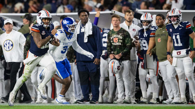 Auburn Tigers quarterback Ashton Daniels started the game against Kentucky before being replaced by Jackson Arnold (11) befor