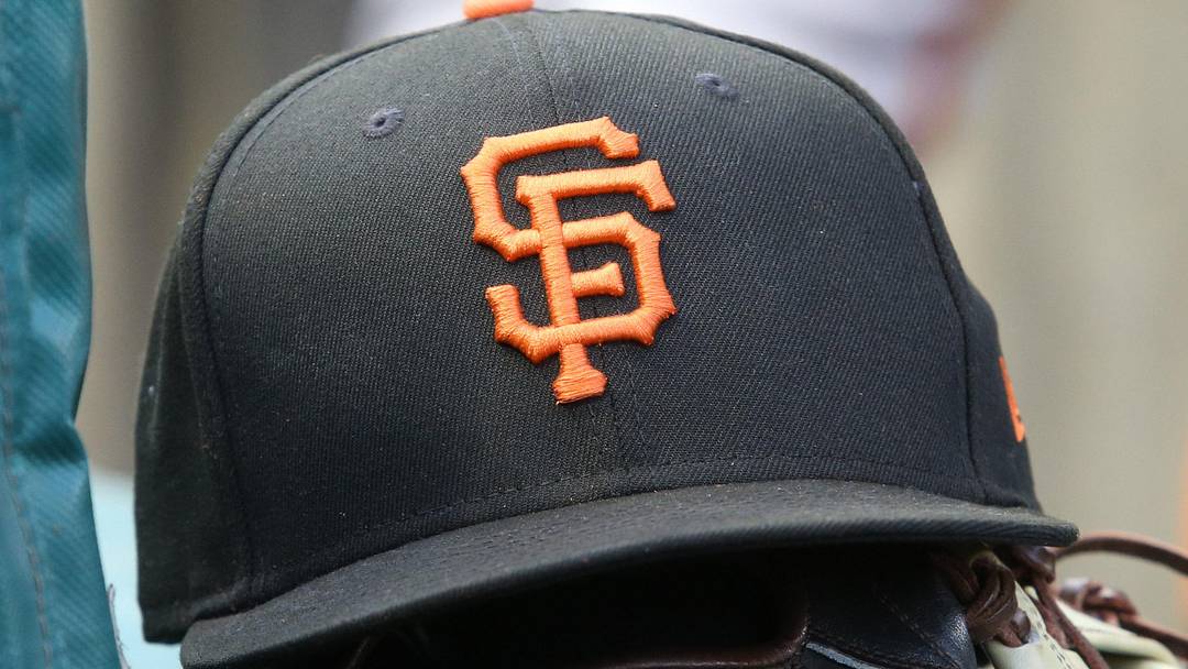 Jul 14, 2023; Pittsburgh, Pennsylvania, USA;  San Francisco Giants hat and glove on the bench against the Pittsburgh Pirates during the first inning at PNC Park.  