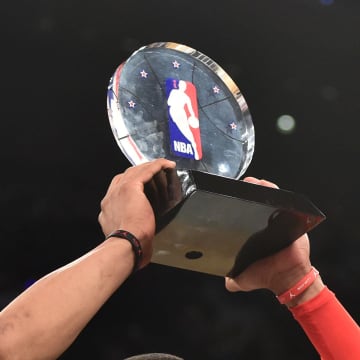 February 15, 2015; New York, NY, USA; Western Conference guard Russell Westbrook of the Oklahoma City Thunder (0) wins the MVP trophy after the 2015 NBA All-Star Game at Madison Square Garden. The West defeated the East 163-158. Mandatory Credit: Bob Donnan-USA TODAY Sports