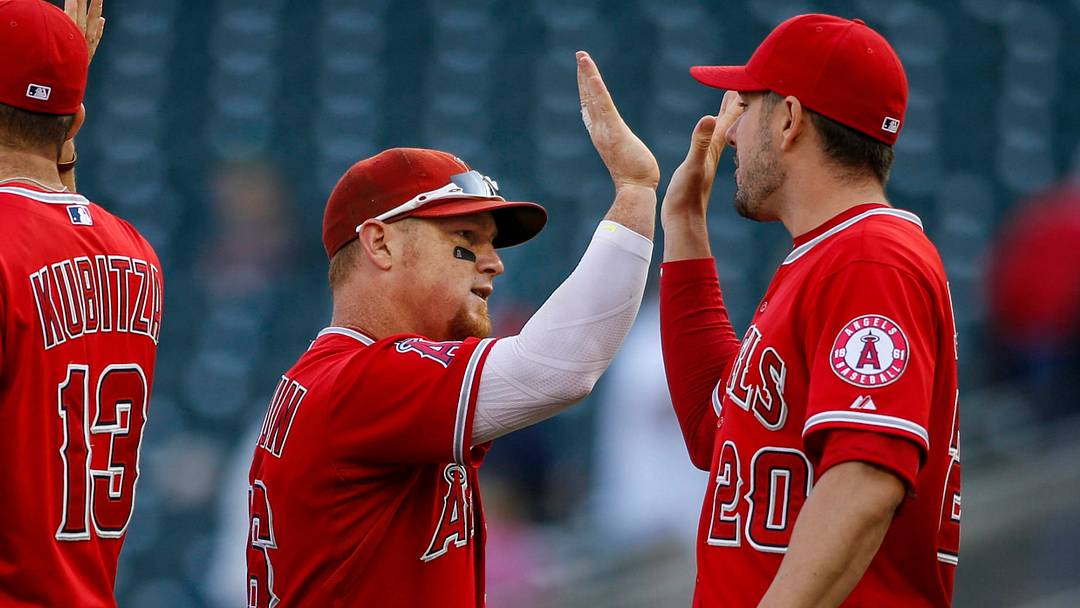 Los Angeles Angels right fielder Kole Calhoun (56) and outfielder Matt Joyce (20) celebrate the 4-3 12 inning win against the Minnesota Twins during game one of a doubleheader at Target Field on Sept. 19, 2015. Los Angeles Angels right fielder Kole Calhoun (56) and outfielder Matt Joyce (20) celebrate the 4-3 12 inning win against the Minnesota Twins during game one of a doubleheader at Target Field on Sept. 19, 2015.