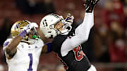 Oct 28, 2023; Stanford, California, USA; Stanford Cardinal wide receiver Jackson Harris (83) hauls in a 43-yard pass in front of Washington Huskies cornerback Jabbar Muhammad (1) during the fourth quarter at Stanford Stadium. Mandatory Credit: D. Ross Cameron-Imagn Images