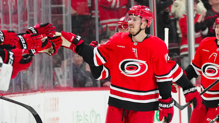 Mar 14, 2025; Raleigh, North Carolina, USA; Carolina Hurricanes center Jack Roslovic (96) celebrates his goal against the Detroit Red Wings during the second period at Lenovo Center. Mandatory Credit: James Guillory-Imagn Images Mar 14, 2025; Raleigh, North Carolina, USA; Carolina Hurricanes center Jack Roslovic (96) celebrates his goal against the Detroit Red Wings during the second period at Lenovo Center. Mandatory Credit: James Guillory-Imagn Images