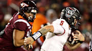 Nov 18, 2023; Blacksburg, Virginia, USA; North Carolina State Wolfpack quarterback Brennan Armstrong (5) runs the ball against the Virginia Tech Hokies at Lane Stadium. Mandatory Credit: Peter Casey-Imagn Images