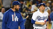 May 10, 2017; Los Angeles, CA, USA; Los Angeles Dodgers starting pitcher Kenta Maeda (18) and starting pitcher Clayton Kershaw (22) head onto the field after a game against the Pittsburgh Pirates at Dodger Stadium. Mandatory Credit: Jayne Kamin-Oncea-Imagn Images