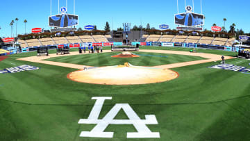 Oct 23, 2017; Los Angeles, CA, USA; Workers put finishing touches on the World Series logo and the field before today's workouts one day prior to game one of the World Series between the Los Angeles Dodgers and the Houston Astros at Dodger Stadium. Mandatory Credit: Jayne Kamin-Oncea-USA TODAY Sports