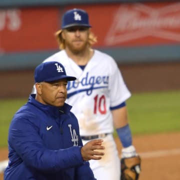 May 28, 2021; Los Angeles, California, USA; Los Angeles Dodgers relief pitcher Kenley Jansen (74) is pulled from the game by manager Dave Roberts (left) in the tenth inning against the San Francisco Giants at Dodger Stadium. Mandatory Credit: Jayne Kamin-Oncea-USA TODAY Sports