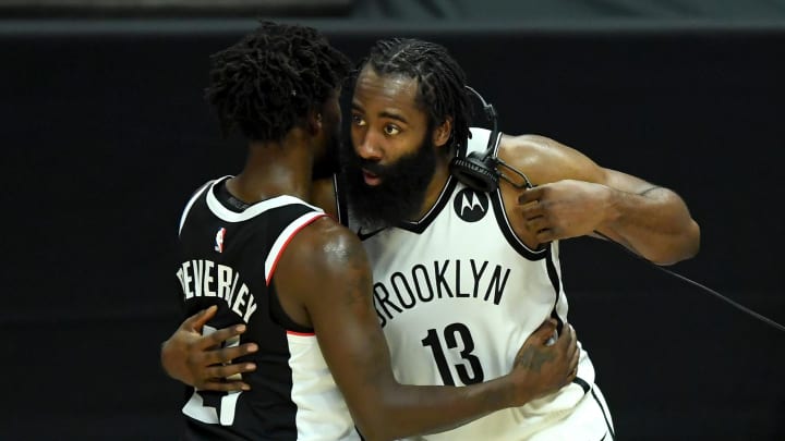 Feb 21, 2021; Los Angeles, California, USA;   Los Angeles Clippers guard Patrick Beverley (21) and Brooklyn Nets guard James Harden (13) shake hands after the game at Staples Center. 