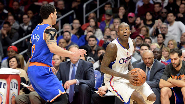 Dec 31, 2014; Los Angeles, CA, USA;  New York Knicks guard Shane Larkin (0) guards Los Angeles Clippers guard Jamal Crawford (11) in the second half of the game at Staples Center.  Clippers won 99-78. Mandatory Credit: Jayne Kamin-Oncea-Imagn Images