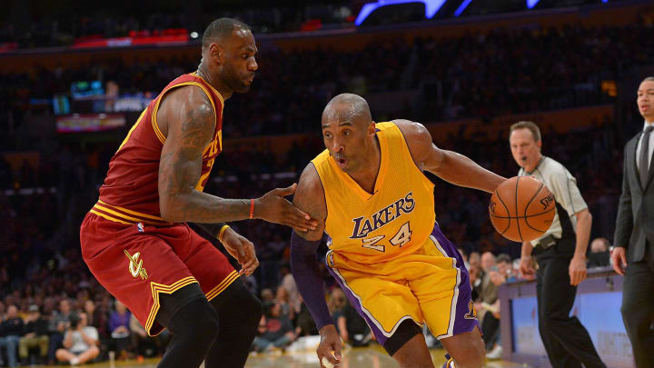 Mar 10, 2016; Los Angeles, CA, USA;  Cleveland Cavaliers forward LeBron James (23) guards Los Angeles Lakers forward Kobe Bryant (24) on the court in the first half of the game at Staples Center. Mandatory Credit: Jayne Kamin-Oncea-USA TODAY Sports