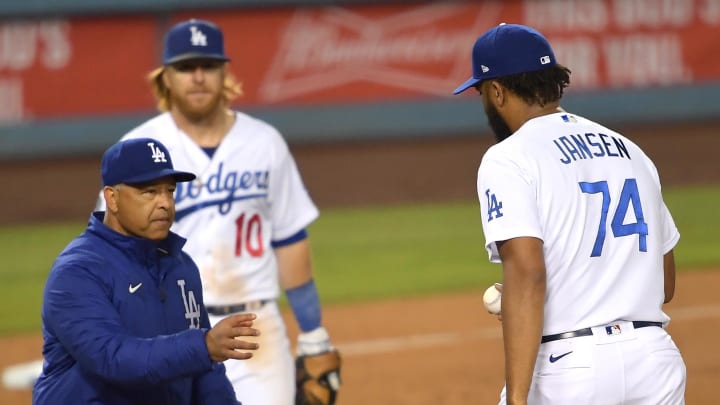 May 28, 2021; Los Angeles, California, USA; Los Angeles Dodgers relief pitcher Kenley Jansen (74) is pulled from the game by manager Dave Roberts (left) in the tenth inning against the San Francisco Giants at Dodger Stadium. Mandatory Credit: Jayne Kamin-Oncea-USA TODAY Sports