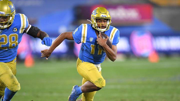 Dec 19, 2020; Pasadena, California, USA; UCLA Bruins quarterback Chase Griffin (11) runs the ball during overtime against the Stanford Cardinal at the Rose Bowl. Mandatory Credit: Jayne Kamin-Oncea-Imagn Images