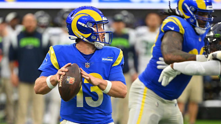 Dec 4, 2022; Inglewood, California, USA; Los Angeles Rams quarterback John Wolford (13) sets to pass in the first half against the Seattle Seahawks at SoFi Stadium.