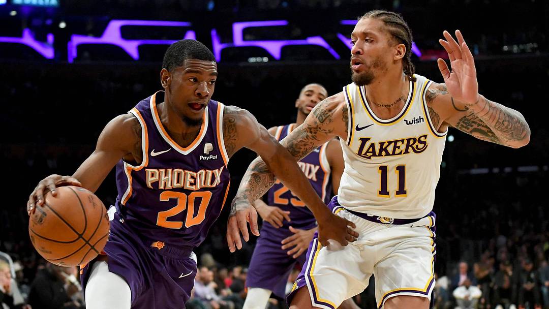 Jan 27, 2019; Los Angeles, CA, USA; Los Angeles Lakers forward Michael Beasley (11) guards Phoenix Suns forward Josh Jackson (20) as he drives to the basket in the first half of the game at Staples Center. Mandatory Credit: Jayne Kamin-Oncea-Imagn Images