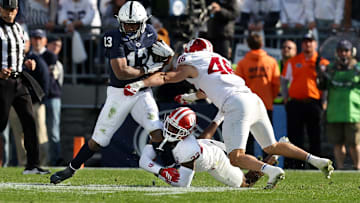 Nov 8, 2025; University Park, Pennsylvania, USA; Penn State Nittany Lions running back Kaytron Allen (13) runs with the ball while trying to avoid a tackle from Indiana Hoosiers defensive back Jamari Sharpe (22) during the second quarter at Beaver Stadium. Mandatory Credit: Matthew O'Haren-Imagn Images