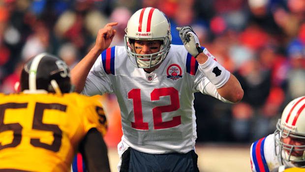 Oct 11, 2009; Denver, CO, USA; New England Patriots quarterback Tom Brady (12) calls an audible against the Denver Broncos in
