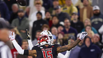 Nov 21, 2024; Atlanta, Georgia, USA; North Carolina State Wolfpack cornerback Tamarcus Cooley (15) breaks up a pass against the Georgia Tech Yellow Jackets in the first quarter at Bobby Dodd Stadium at Hyundai Field. Mandatory Credit: Brett Davis-Imagn Images