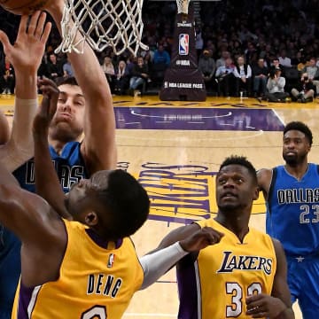 Dec 29, 2016; Los Angeles, CA, USA;  Dallas Mavericks center Andrew Bogut (6), Los Angeles Lakers center Timofey Mozgov (20) and Los Angeles Lakers forward Luol Deng (9) battle for a rebound in the first half of the game at Staples Center. Mavericks won 101-89. Mandatory Credit: Jayne Kamin-Oncea-USA TODAY Sports