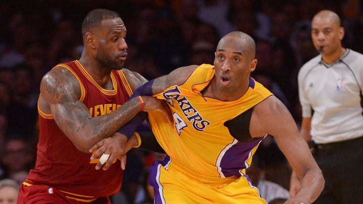 Mar 10, 2016; Los Angeles, CA, USA;  Cleveland Cavaliers forward LeBron James (23) guards Los Angeles Lakers forward Kobe Bryant (24) on the court in the first half of the game at Staples Center. Mandatory Credit: Jayne Kamin-Oncea-USA TODAY Sports