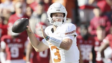 Nov 16, 2024; Fayetteville, Arkansas, USA; Texas Longhorns quarterback Quinn Ewers (3) passes in the first quarter against the Arkansas Razorbacks at Donald W. Reynolds Razorback Stadium. Mandatory Credit: Nelson Chenault-Imagn Images