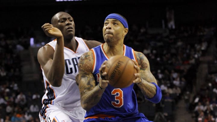 Jan 14, 2014; Charlotte, NC, USA; New York Knicks forward Kenyon Martin (3) prepares to shoot as he is defended by Charlotte Bobcats forward center Bismack Biyombo (0) during the first half of the game at Time Warner Cable Arena. Mandatory Credit: Sam Sharpe-USA TODAY Sports