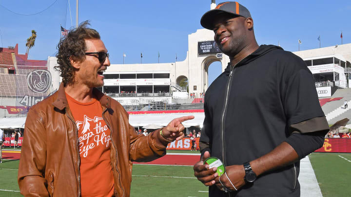 Sep 16, 2017; Los Angeles, CA, USA; Matthew McConaughey (L) and former Texas Longhorns quarterback Vince Young (R) meet on the sidelines before the game against the USC Trojans at Los Angeles Memorial Coliseum. Mandatory Credit: Jayne Kamin-Oncea-USA TODAY Sports