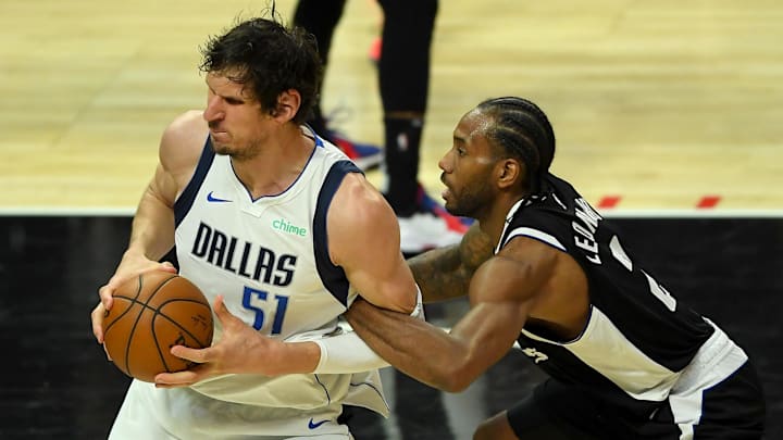 Los Angeles Clippers forward Kawhi Leonard (2) fouls Dallas Mavericks center Boban Marjanovic (51) during the second half of game 5 of round one of the 2021 NBA Playoffs at Staples Center. Mandatory Credit: Jayne Kamin-Oncea-Imagn Images