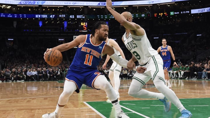 Apr 11, 2024; Boston, Massachusetts, USA;  New York Knicks guard Jalen Brunson (11) controls the ball while Boston Celtics guard Derrick White (9) defends during the first half at TD Garden. Mandatory Credit: Bob DeChiara-USA TODAY Sports