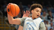 Oct 4, 2025; Charlotte, NC, USA; North Carolina Tar Heels guard Kyan Evans (0) grabs a rebound in the second half at Dean E. Smith Center. Mandatory Credit: Bob Donnan-Imagn Images