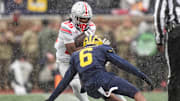 Ohio State running back Bo Jackson (25) runs against Michigan defensive back Brandyn Hillman (6) during the second half at Michigan Stadium in Ann Arbor on Saturday, Nov. 29, 2025.