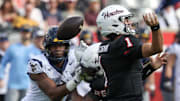 Houston Cougars quarterback Conner Weigman (1) fumbles the ball against the West Virginia Mountaineers in the first half at TDECU Stadium.